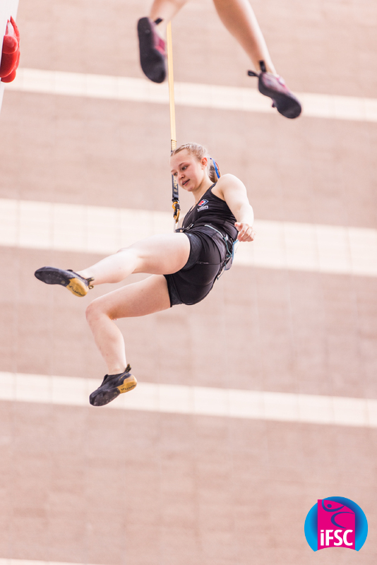Madi Walsh hanging from harness